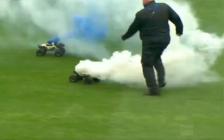 Soccer Match Interrupted By Remote-controlled Cars Carrying FLARES