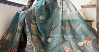 Tranquil Tales: The Teal Pichwai Saree Adorned With Cows And Lotus