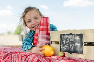 How To Help Your Kid Make Bank On Their Lemonade Stand, According To Experts