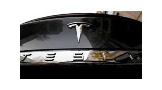Tesla Profits Slump By More Than A Half