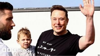 Watch: Musk And Son Visit Tesla Plant After Fire