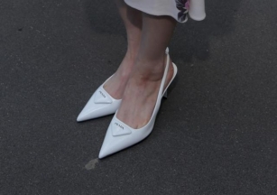Twice’s Sana Re-Wears Her Favorite White Slingback Heels At Prada’s Summer 2025 Show During Milan Fashion Week