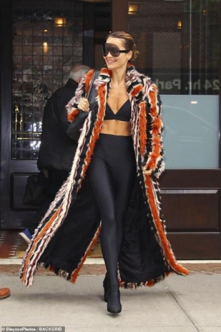 Rita Ora Showcases Her Chiselled Abs In A Tiny Black Bralette And Eye-catching Fluffy Coat As She Leaves Her Hotel In NYC Ahead Of The Met Gala