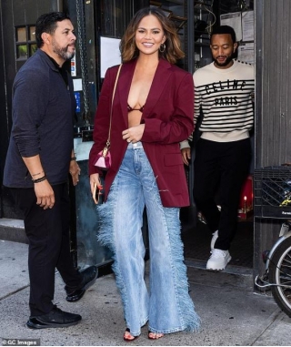 Chrissy Teigen Rocks Tiny Bra Top Under Berry-toned Blazer As She And Husband John Legend Enjoy Lunch In NYC