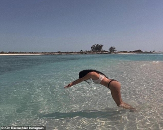 Kim Kardashian Showcases Signature Curves In Tiny Black Bikini As She Inexplicably Dives Into Knee-deep Water In Turks And Caicos Vacation Photos