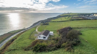A Home With Huge Potential With A Cliffside Setting
