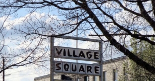 The Sign At The Village Square
