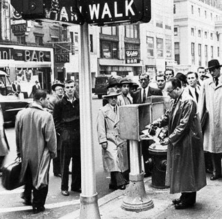 Pedestrians Watching Traffic Signal Activation On 7th Ave. In Manhattan On April 20, 1955